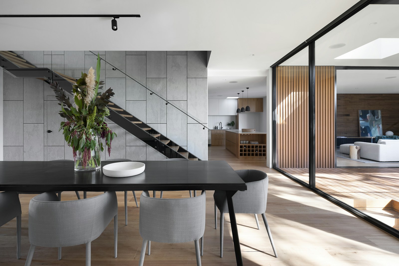 A light-filled contemporary living room with natural finishes